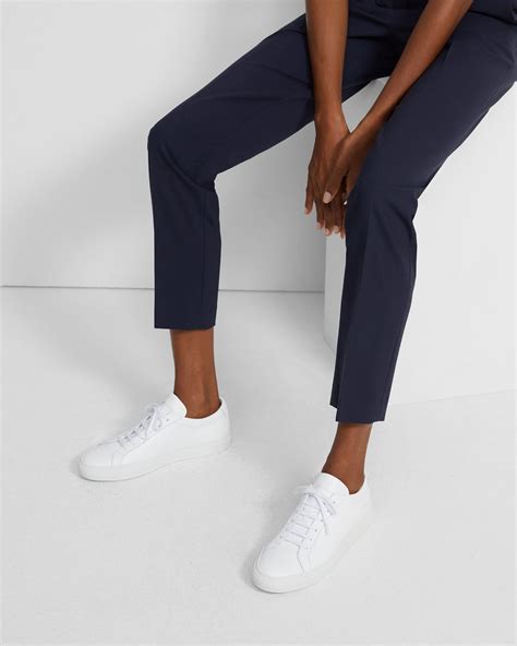 woman by common projects sneakers